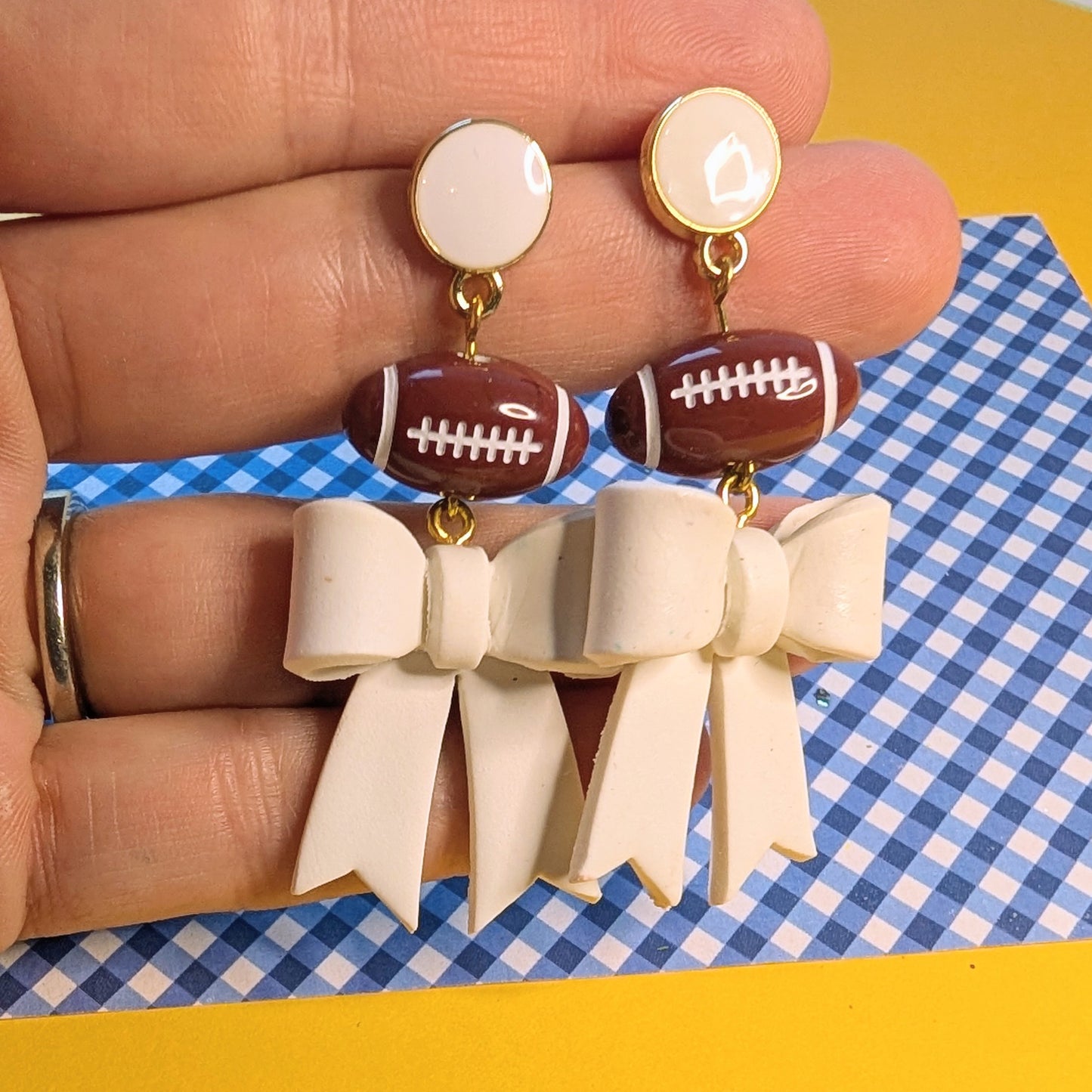 White Bow Football Dangle Earrings
