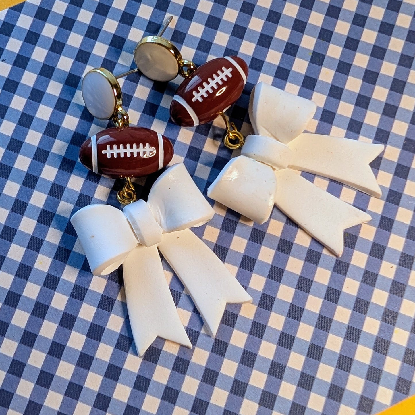 White Bow Football Dangle Earrings
