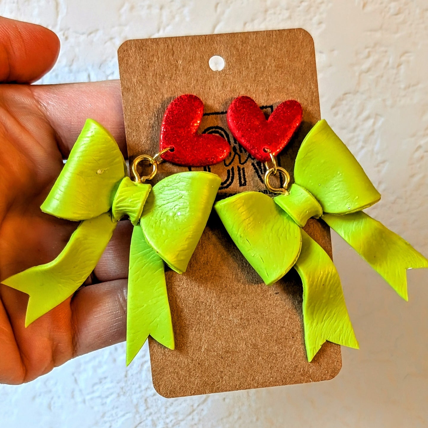 Grinch-y bows polymer clay dangle earrings