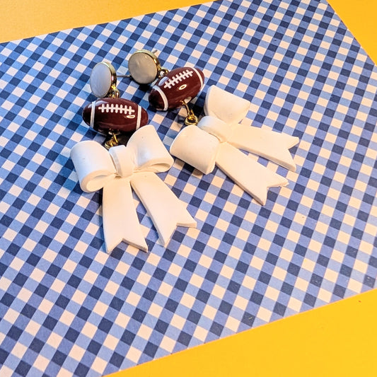 White Bow Football Dangle Earrings