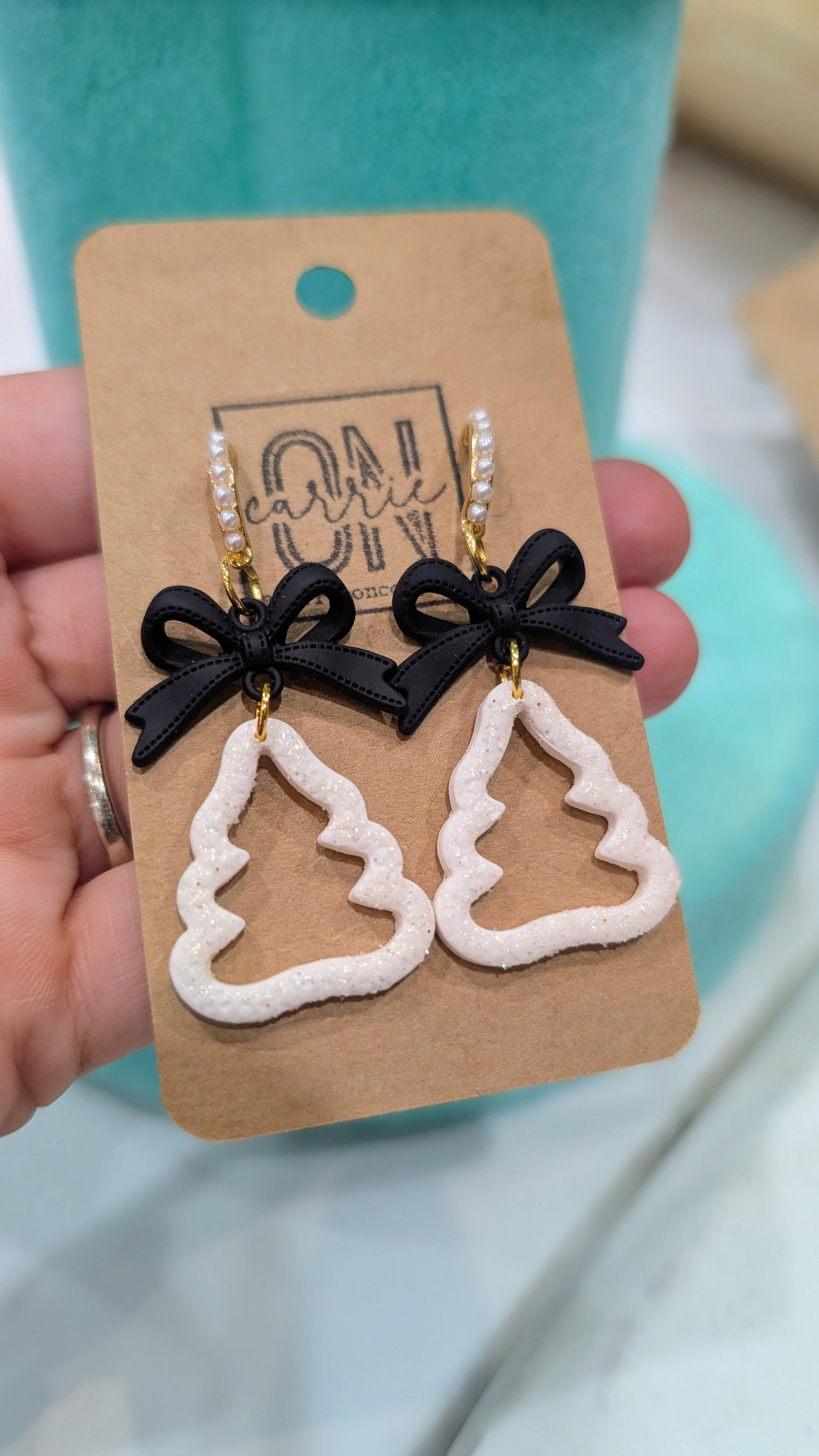 Black and white Christmas tree and bow dangle earrings